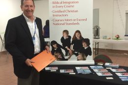 Sevenstar founder standing at booth promoting Sevenstar.