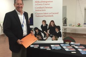 Sevenstar founder standing at booth promoting Sevenstar.